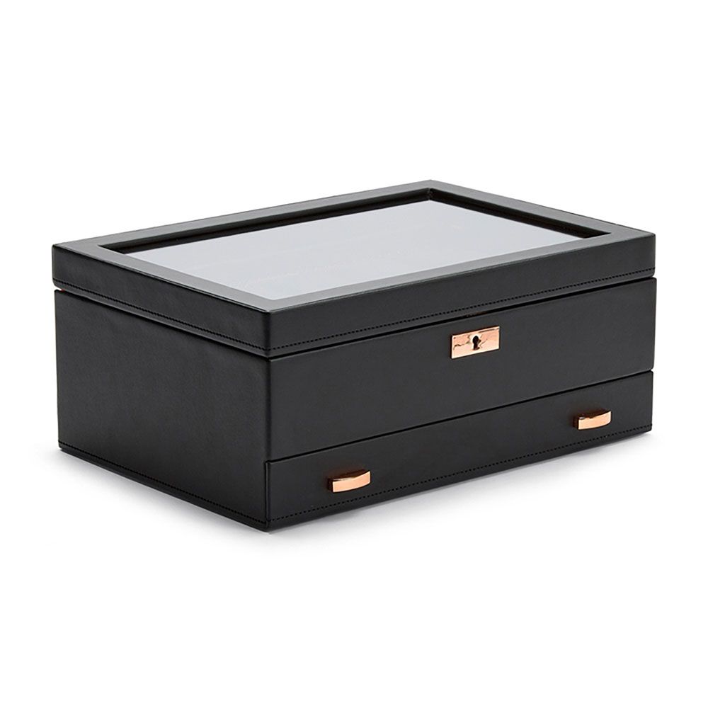 The WOLF 1834 Axis 10 Piece Watch Box With Drawer by WOLF is displayed on a white background, featuring black leather construction, a glass top, gold-tone lock and two gold-tone drawer handles, offering elegant watch storage with classic lock and key security.