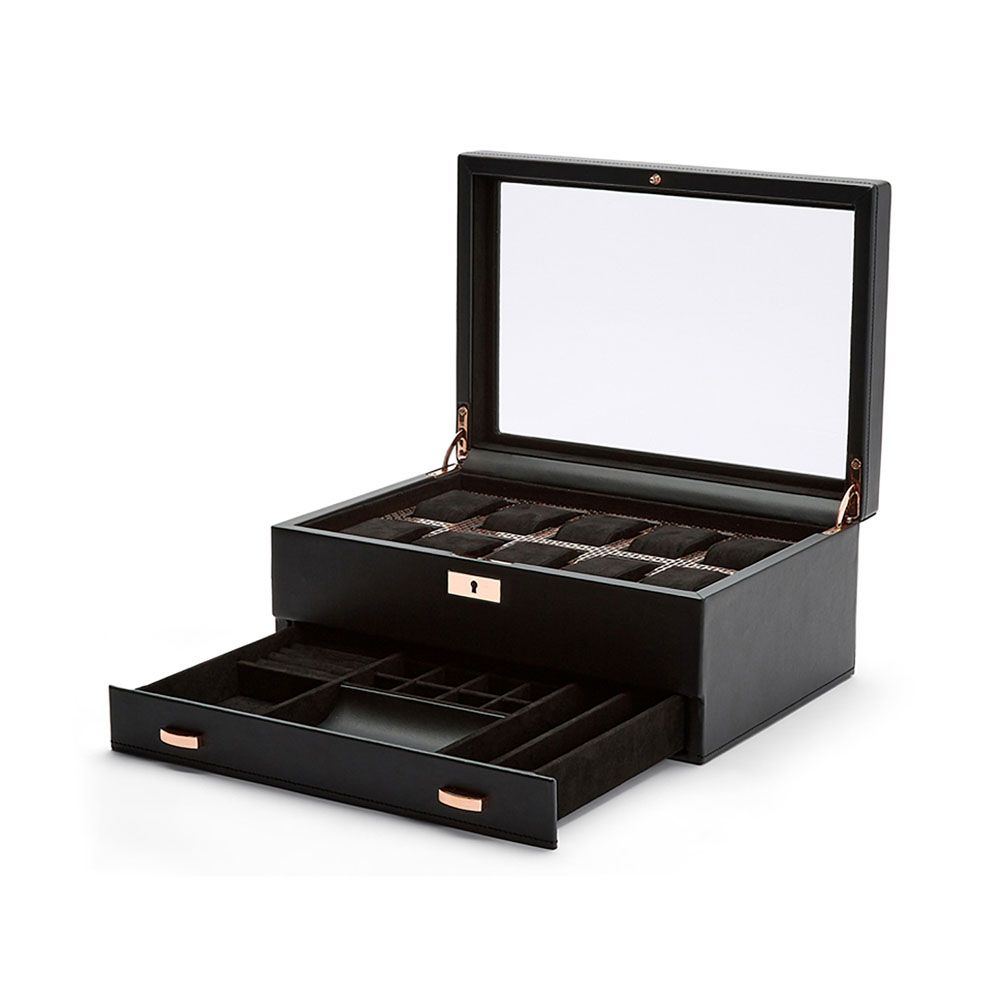 The WOLF 1834 Axis 10 Piece Watch Box With Drawer by WOLF features a sleek black exterior with an open lid displaying organized compartments for watch storage and accessories, plus a pull-out drawer below offering extra sections. Designed with gold-tone handles, lock-and-key security for added peace of mind, and a plush dark interior.