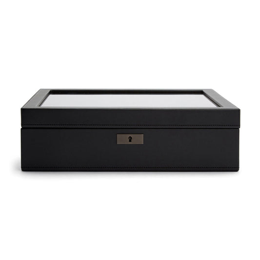 The image is centered on the WOLF 1834 Axis 15 Piece Watch Box, a sleek and elegant black storage box with a glass top. It includes a small keyhole on the front, offering lock and key security for added safety and embodying a minimalist design.