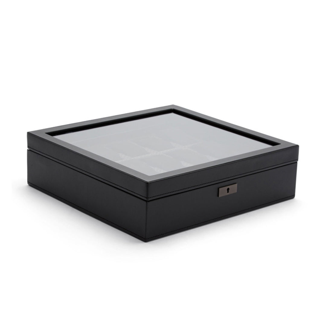 The WOLF 1834 Axis 15 Piece Watch Box, crafted by WOLF, is a sleek and modern black watch case featuring a glass top that elegantly displays your watch collection. With multiple compartments for storage and lock and key security, it ensures both stylish display and secure protection for up to 15 watches, including smartwatches.