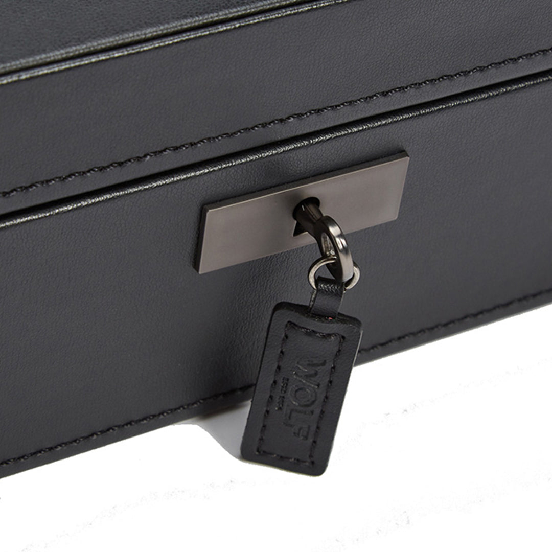 The WOLF 1834 Axis 15 Piece Watch Box, featuring a sophisticated metal lock and key security system, comes with a leather tag embossed with "WOLF." This black leather storage box is ideal for protecting your treasured smart watch collection against a pristine white background.