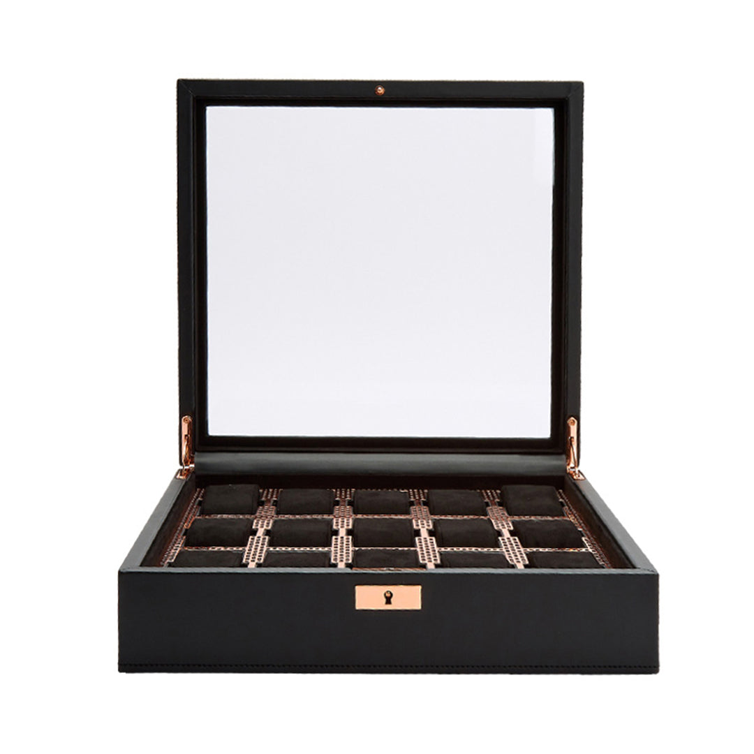 The WOLF 1834 Axis 15 Piece Watch Box, offered by the renowned brand WOLF, is an open black watch box featuring a glass lid that elegantly displays its multiple compartments lined with soft, dark material. Ideal for sophisticated watch storage, it accommodates various timepieces, including your latest smartwatch. The box also includes lock and key security with a metallic lock on the front.