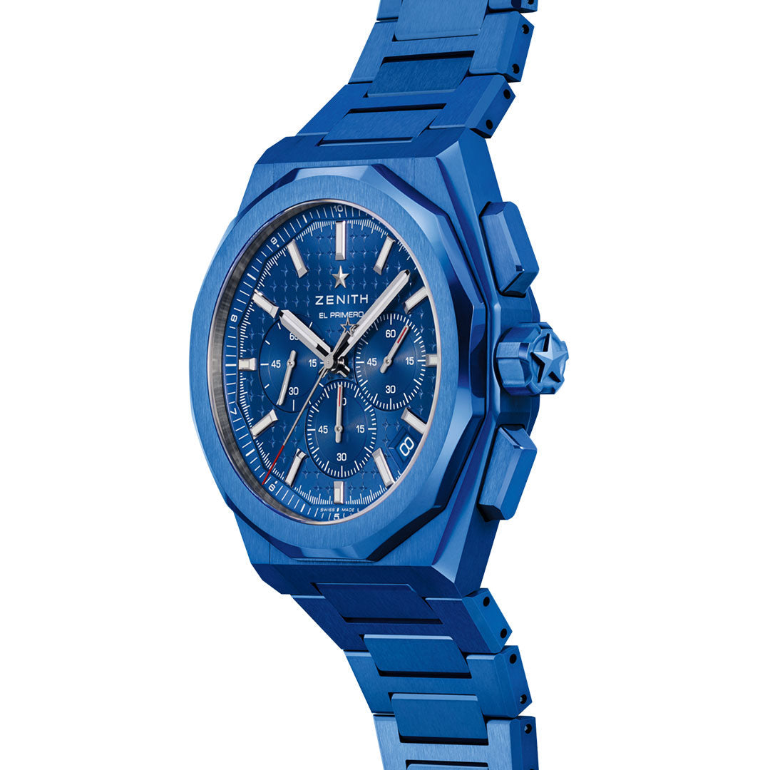 The ZENITH Defy Skyline Chronograph 160th Anniversary Limited Edition El Primero 3600 is a 42mm blue luxury watch featuring a matching metal band, detailed dial with three subdials, date display, silver hands, and a geometric bezel.
