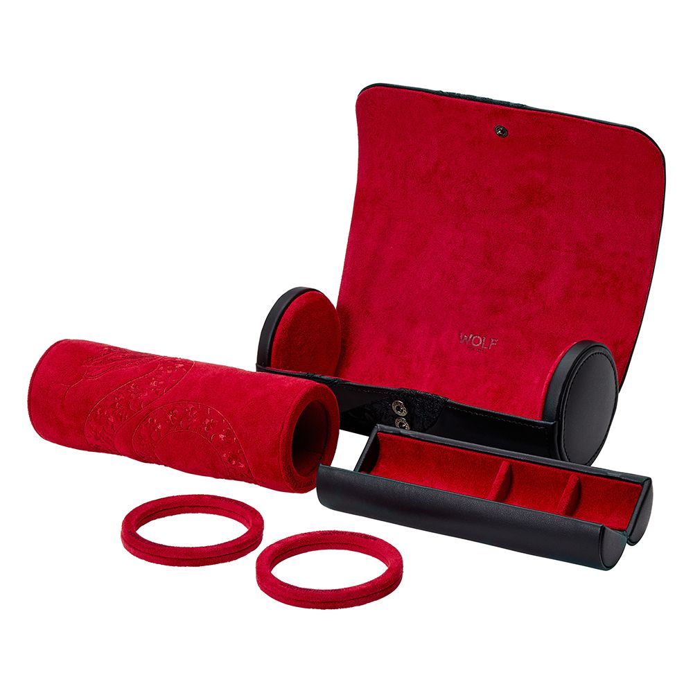 The WOLF 1834 Lunar Triple Watch Roll by WOLF features red velvet, black leather, a rolled cushion, two ring holders, and red fabric-lined compartments. Displayed open here with its special edition Chinese New Year gift box.