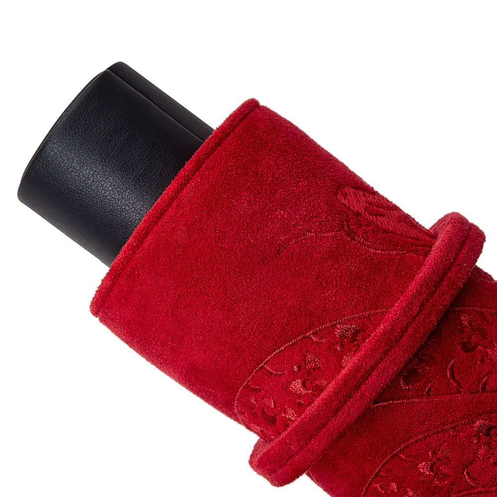 The WOLF 1834 Lunar Triple Watch Roll by WOLF features a black cylindrical special edition gift box, partially wrapped in red, textured, patterned fabric with decorative embroidery.