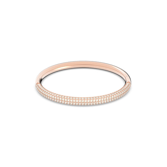 Showcased on a white background, the Swarovski Rose Gold Plated Stainless Steel Stone Bangle features sleek, elegant curves and is adorned with small, shimmering stones across its surface. Crafted by Swarovski, this refined bracelet boasts a sophisticated rose gold finish.
