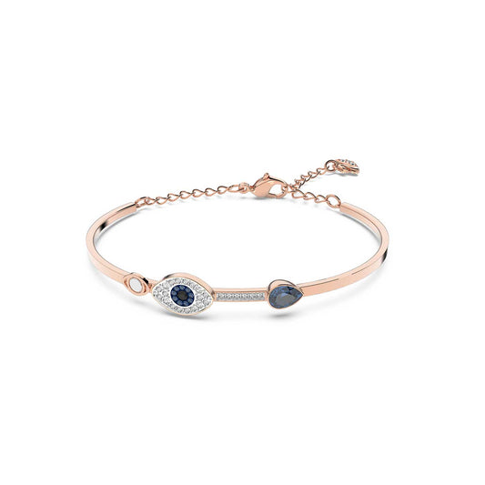 The Swarovski Evil Eye Bangle by Swarovski is a stylish, mixed-plated bangle showcasing an eye-shaped design embellished with blue crystals and white stones. It features a small round blue stone and a clasp with an adjustable chain for a perfect fit.