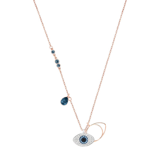 The Swarovski Duo Evil Eye Necklace by Swarovski boasts a rose gold-plated chain and a captivating Evil Eye pendant embellished with blue and white stones, enhanced by an intricate side detail of small blue gemstones.