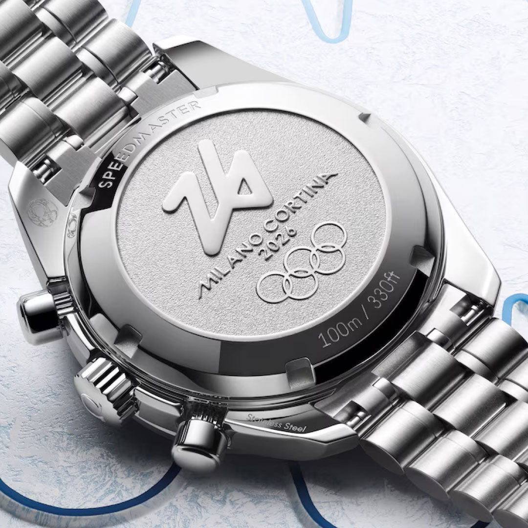 Close-up of the OMEGA Speedmaster 38 Co-Axial Chronometer Chronograph 38mm Watch Milano Cortina 2026 Edition, featuring a stainless steel caseback engraved with "MILANO CORTINA 2026," Olympic rings, "SPEEDMASTER," and "100m / 330ft.