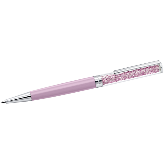 The Swarovski Crystalline Ballpoint Pen by Swarovski is a sleek lilac pen with a lavender barrel and a silver tip. Its transparent upper part reveals decorative purple crystals, showcasing the elegant crystalline technique.