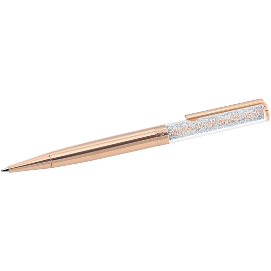 The Swarovski Rose Gold Crystalline Ballpoint Pen by Swarovski showcases a polished rose gold-plated finish with a clear barrel partially filled with delicate, sparkling crystals. It features an exquisite Crystalline technique and includes a matching gold clip.
