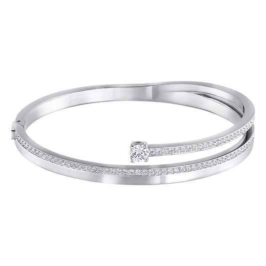The Swarovski Fresh Bangle boasts a modern, minimalist look with its sleek silver design featuring two parallel rhodium-plated bands adorned with small diamonds. At the center, a larger diamond accent is prominently set, adding elegance to the piece.