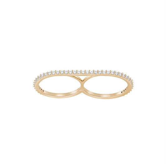 The Swarovski brand's Vittore Double Ring is a contemporary jewelry piece, showcasing a chic double gold band design. It’s embellished with tiny, shimmering crystals lining the top surface and crafted to elegantly adorn two fingers, creating a symmetrical and modern look against a simple white backdrop.
