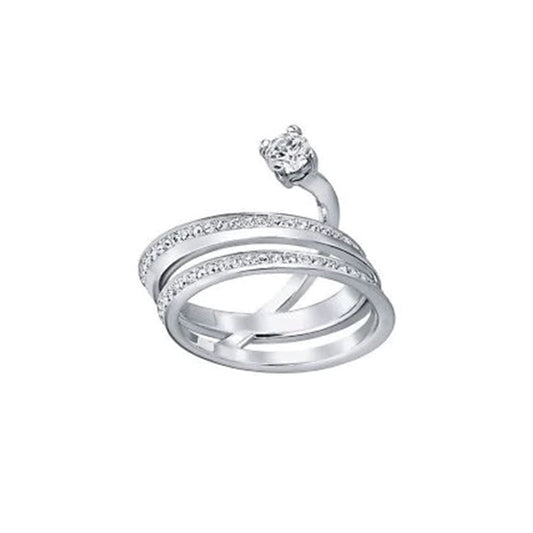 The Swarovski Fresh Spiral Ring, crafted by Swarovski, is a silver double-band piece adorned with small crystals and topped with a larger round diamond, offering an elegant and modern spiral design.