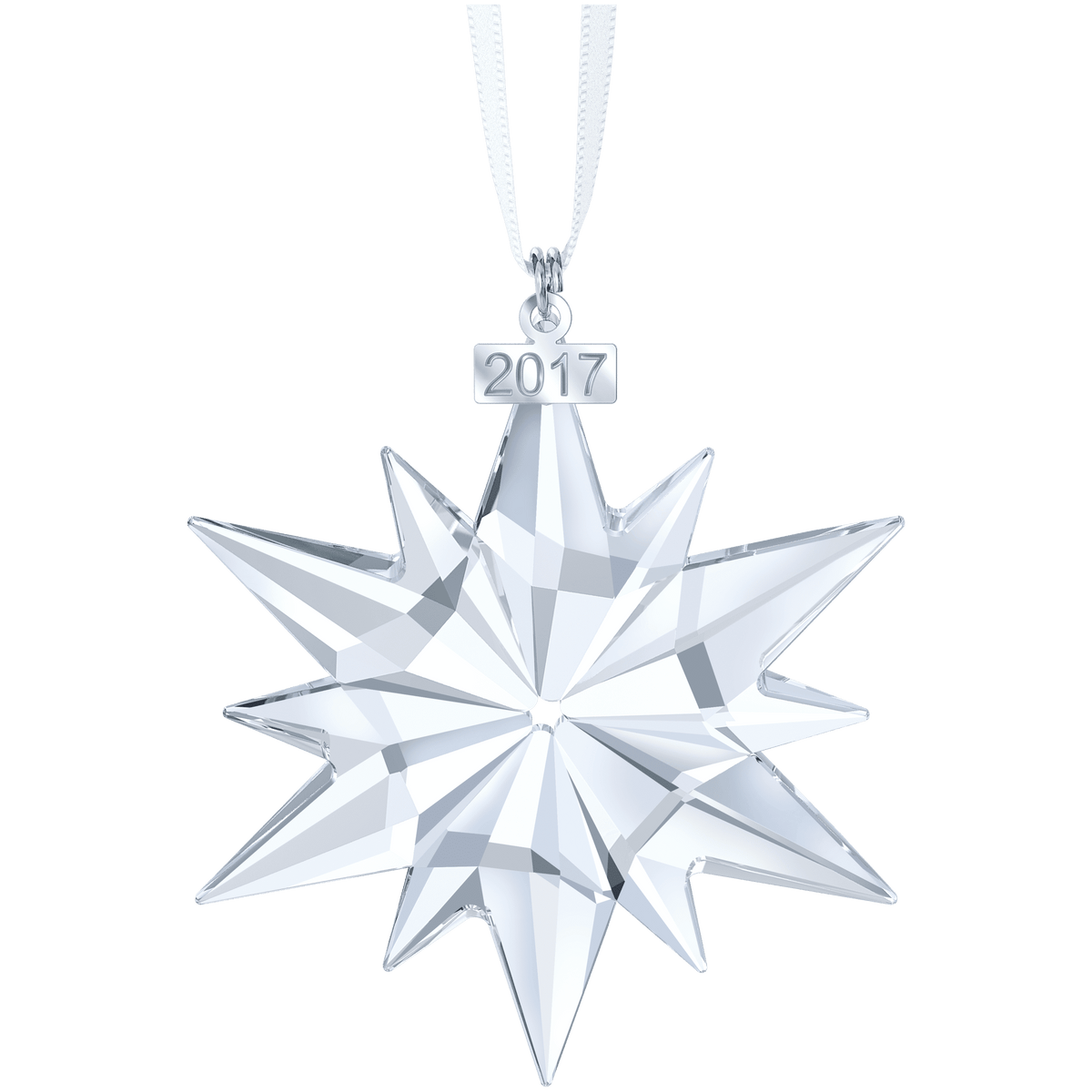 The Swarovski Annual Edition Ornament 2017 by Swarovski features a clear crystal star with multiple points, suspended from a white ribbon. A silver tag above the ornament displays the year “2017.” Available at Raffi Jewellers, this sparkling decoration is set against a simple, light background.