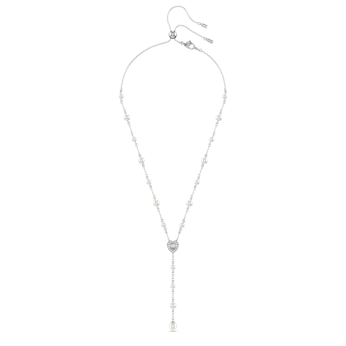 A Swarovski Ariana Grande x Swarovski Y necklace in white rhodium plate, featuring mixed cut crystals, a heart-shaped central pendant, and a drop chain ending in a crystal pearl charm, is displayed on a plain white background.
