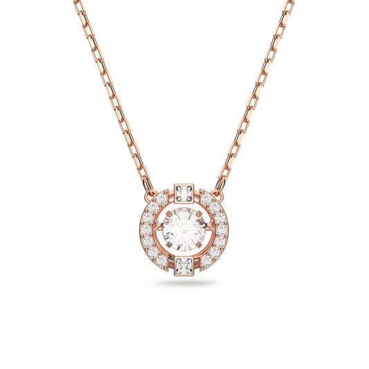 The Swarovski Sparking Dance Necklace, crafted by Swarovski, features a rose gold-plated design with a round pendant. At its center, a circular diamond shimmers with motion, surrounded by smaller diamonds and two square ones on the outer ring. The delicate chain beautifully complements the sparkling pendant, making it an ideal addition to your jewelry collection.