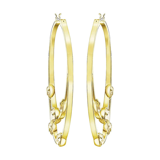 A pair of Swarovski Gaze Hoop Earrings in a large size, featuring gold hoops embellished with decorative patterns and clasp closures at the top; these sparkling crystals add a touch of elegance reminiscent of the renowned Swarovski brand.