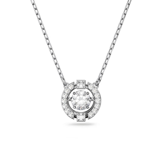 The Swarovski Sparkling Dance Necklace, crafted by Swarovski, is an exquisite rhodium-plated piece featuring a round pendant adorned with a large central dancing crystal encircled by stunning crystal pavé. The pendant hangs symmetrically on a delicate chain, offering an elegant touch to any outfit.