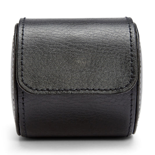 Introducing the WOLF 1834 Blake Single Watch Roll, a product of exceptional craftsmanship by WOLF. This watch roll is crafted from handcrafted top-grain leather and boasts a textured surface with visible stitching. Its closed design includes a secure fold-over flap, and the slightly glossy finish highlights the high-quality materials used in its creation.