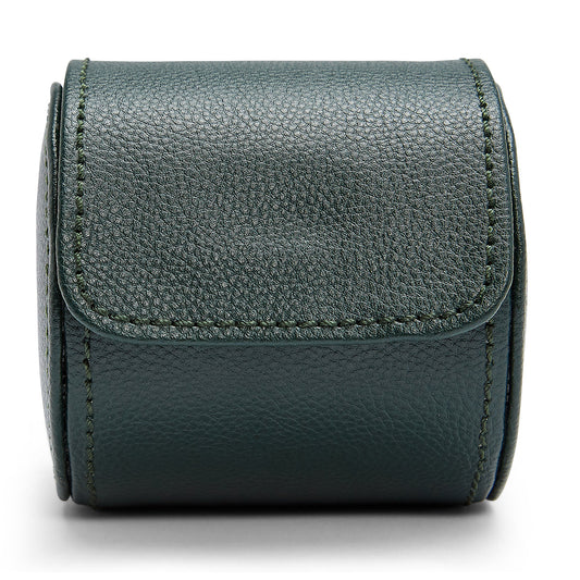 The WOLF 1834 British Racing Green Single Watch Roll showcases a luxurious green textured leather with a flap closure, tailored for storing one watch. Its cylindrical form is compact yet robust, making it perfect for holding small items or accessories. The prominent stitching along the edges adds an elegant finish to this handcrafted piece, embodying the British Racing style.
