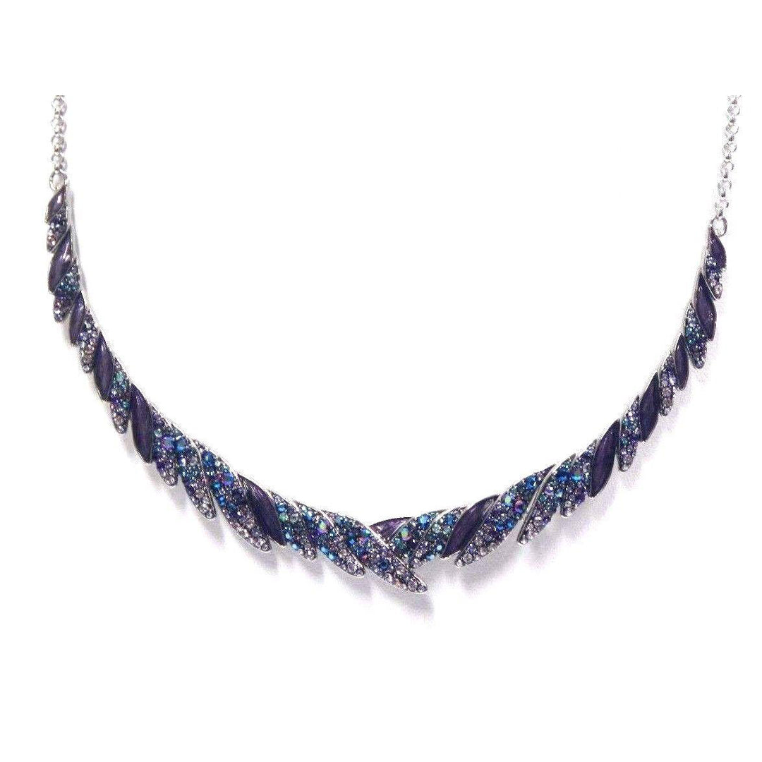The Swarovski Hearty Necklace Pendant by Swarovski is a stunning piece, showcasing heart-shaped pendants and elegant leaf-shaped segments adorned with blue and purple sparkling stones, symmetrically arranged along a silver chain. This multi-colored creation adds sophistication to any outfit.
