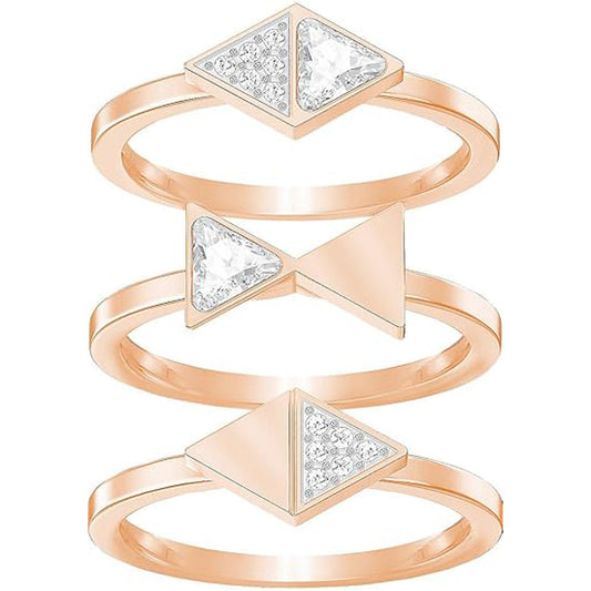 The Swarovski Heroism Ring Set by Swarovski features three interlocking rings with triangular designs. The top and bottom rings are embellished with pavé-enhanced triangles, showcasing small clear stones on one half and a larger stone on the other, while the middle ring presents a solid triangular pattern for an eye-catching appearance.