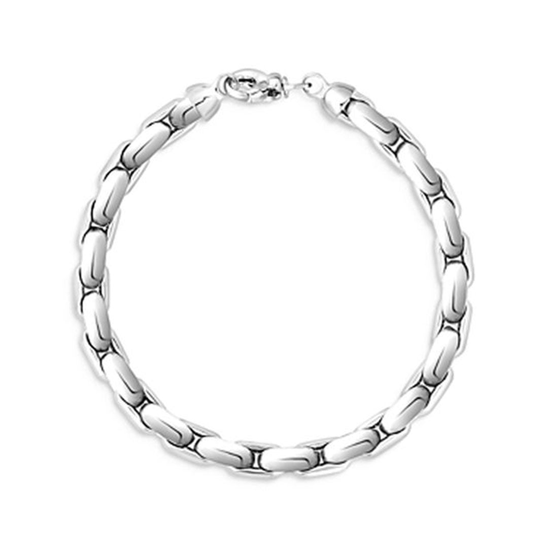 The Roberto Coin Oro Classic 18K White Gold Link Bracelet is beautifully crafted with smooth, oval-shaped links seamlessly connected in a circular design. Its elegant and simplistic style, complete with a clasp fastening, embodies timeless sophistication.