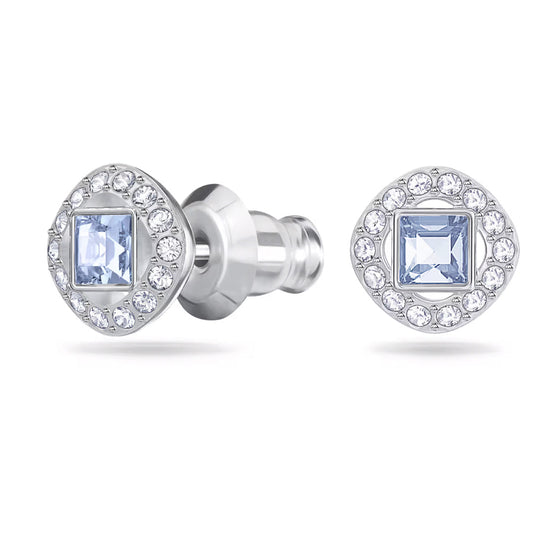 The Swarovski Una Angelic Stud Earrings by Swarovski showcase a stunning blue square-cut gemstone at their center, elegantly surrounded by small clear crystals and finished with a rhodium plating.