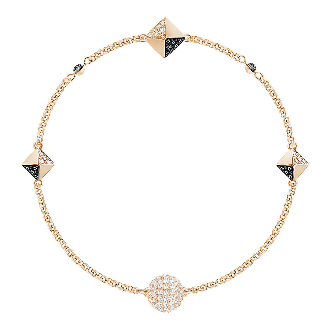 Introducing The Swarovski Remix Collection Bracelet by Swarovski, this adaptable piece shines with pyramid-shaped accents and radiant crystals. The design features alternating pyramid motifs and a spherical motif adorned with small white stones, all linked together by a delicate chain.