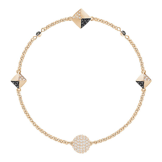 Introducing The Swarovski Remix Collection Bracelet by Swarovski, this adaptable piece shines with pyramid-shaped accents and radiant crystals. The design features alternating pyramid motifs and a spherical motif adorned with small white stones, all linked together by a delicate chain.