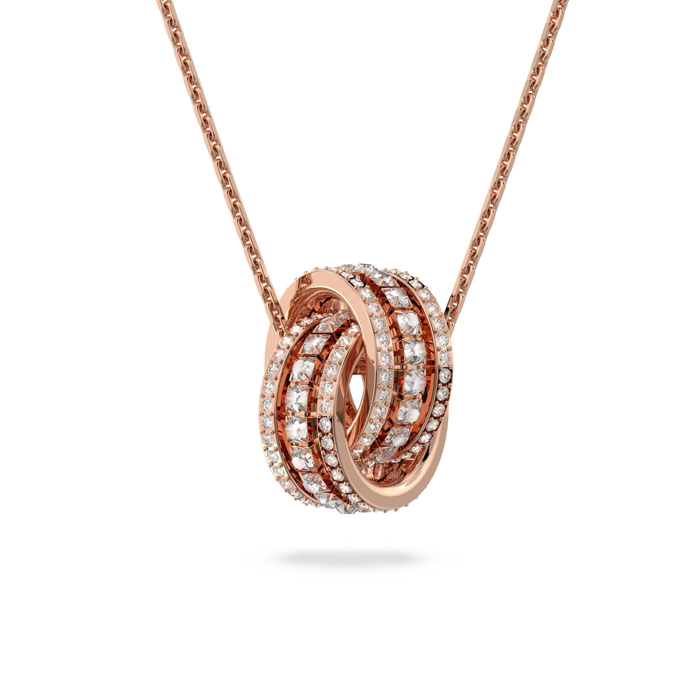The Swarovski Interlocking Loop Pave Further Necklace Pendant by Swarovski features a stunning rose gold-plated pendant adorned with clear crystals, beautifully encrusted around the intertwining loops. This shimmering pendant hangs from a delicate chain, offering an elegant and luxurious design enhanced by Swarovski's signature sparkle.