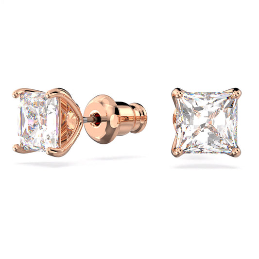 Swarovski presents the Stilla Attract Stud Earrings, a captivating pair set in rose gold with princess-cut, sparkling stones. These earrings feature a prong setting and are displayed from side and front views to emphasize their intricate design and dazzling allure.
