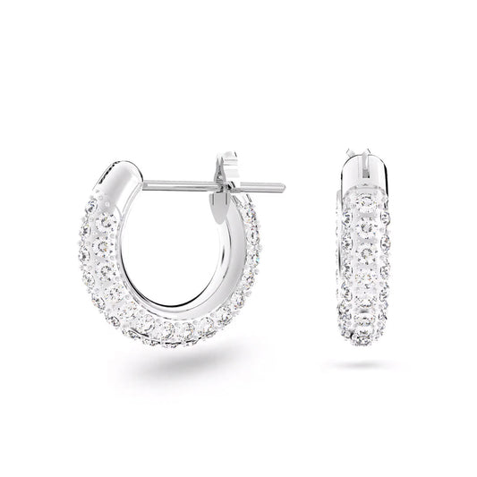 The Swarovski Dextera Hoop Earrings are a stunning pair of jewelry pieces, featuring numerous small diamonds set in shiny rhodium-plated silver. Displayed with one earring facing forward and the other from the side, they highlight their clear pavé design against a plain white background, perfectly capturing the essence of minimalist jewelry.