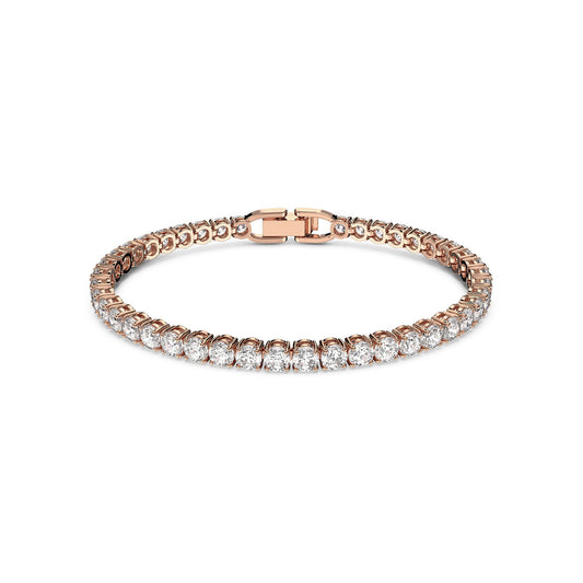 The Swarovski Round Cut Tennis Deluxe Bracelet is a captivating piece, showcasing round, sparkling diamonds set in a continuous line. This rose gold-plated bracelet features a sleek clasp, enhancing its elegant and luxurious design against a plain white background, making it perfect for those who appreciate timeless Swarovski craftsmanship.