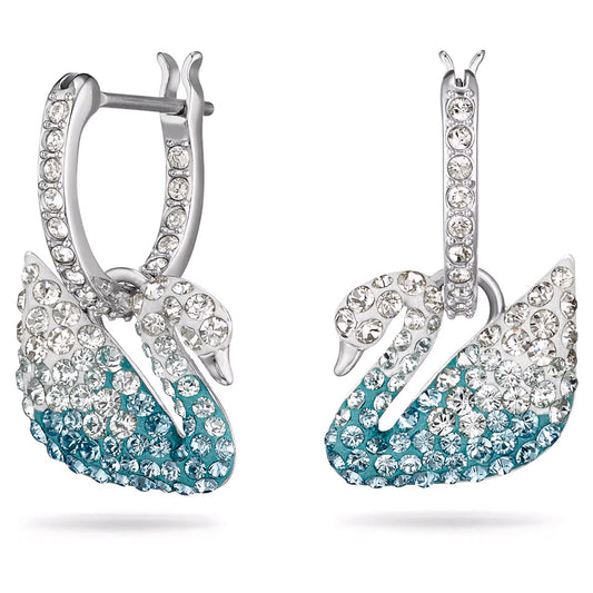 Introducing the Swarovski Swan Drop Earrings, a stunning pair of earrings crafted by Swarovski. These silver swan-shaped earrings are beautifully adorned with the crystal Pointiage® technique, featuring sparkling clear and teal crystals.