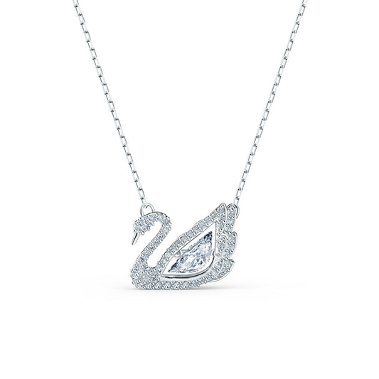 Introducing the Swarovski Dancing Swan Necklace, a refined piece of jewelry from Swarovski. This rhodium-plated necklace boasts a swan-shaped pendant adorned with tiny crystals and highlights a prominent teardrop-shaped crystal at its center. The delicate chain enhances the elegance of this stunning swan necklace.