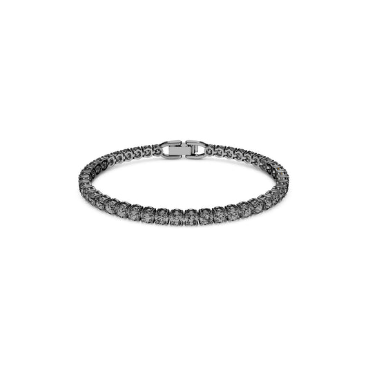 The Swarovski Tennis Deluxe Bracelet, crafted by the renowned brand Swarovski, is a silver tennis bracelet adorned with round crystals and secured with a clasp closure. This elegant piece is showcased against a plain white background.