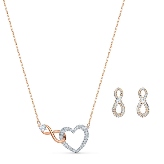 Introducing the Swarovski Infinity Jewellery Set, an exquisite necklace showcasing intertwined heart and infinity symbols embellished with shimmering stones. Paired with matching earrings in a similar design, this set from our Swarovski collection makes the perfect romantic gift.