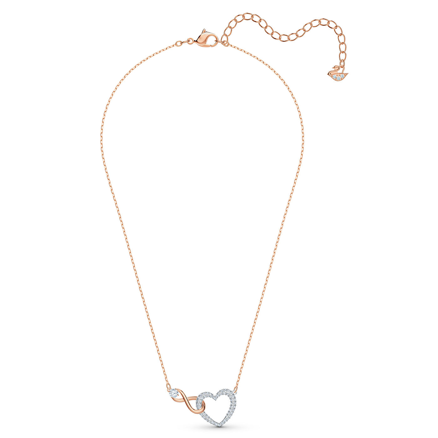 The Swarovski Infinity Jewellery Set includes a delicate gold necklace featuring a heart-shaped pendant encrusted with small diamonds and an intertwined infinity symbol, making it an ideal romantic gift. The adjustable chain, complete with a small tag at the clasp, enhances the elegance of this stunning piece from Swarovski.
