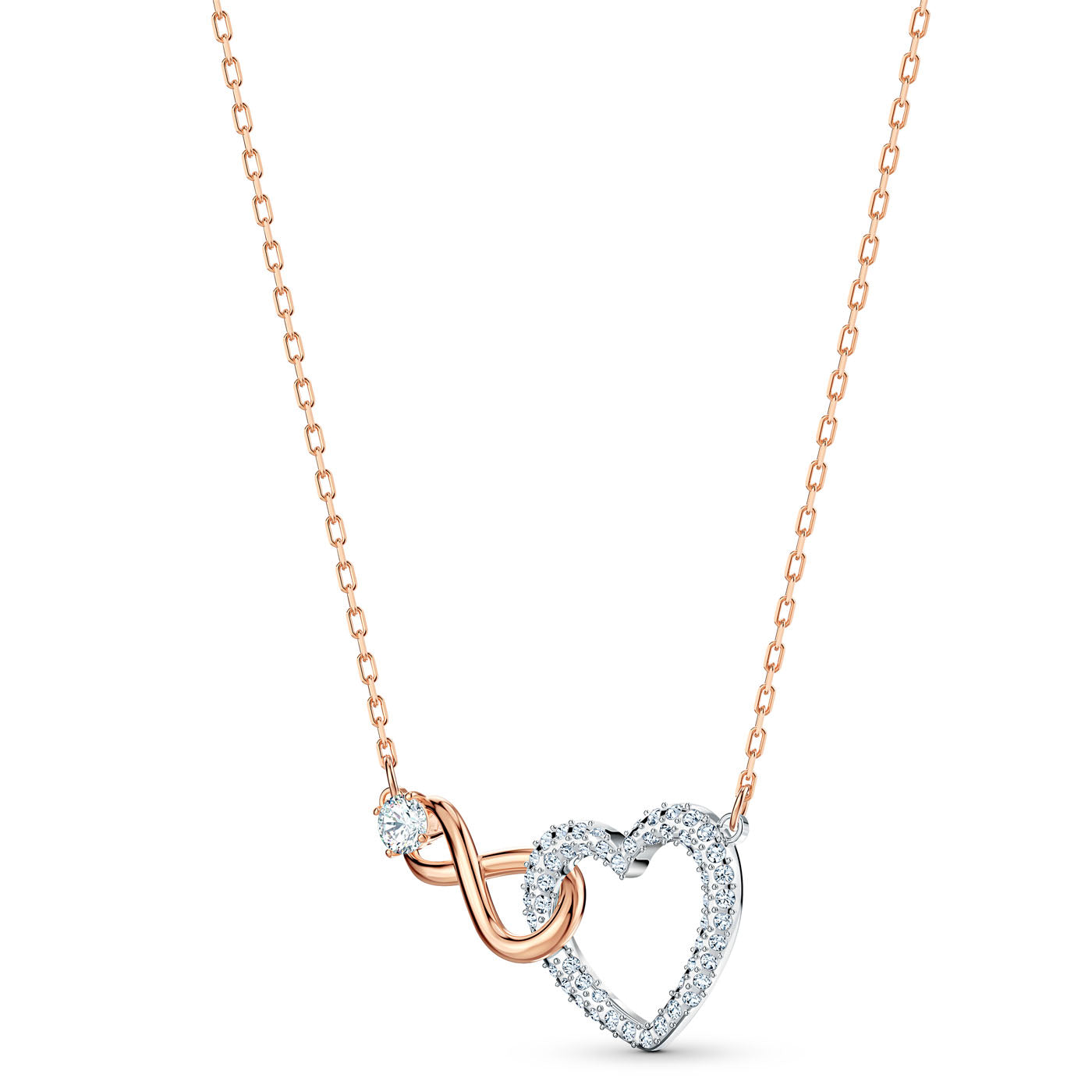 This romantic gift, the Swarovski Infinity Jewellery Set by Swarovski, showcases a delicate gold chain with a pendant shaped like a heart intertwined with infinity symbols. The heart is adorned with small diamonds, complemented by a single diamond accent on the chain, giving it an exquisite appearance reminiscent of classic Swarovski jewelry.