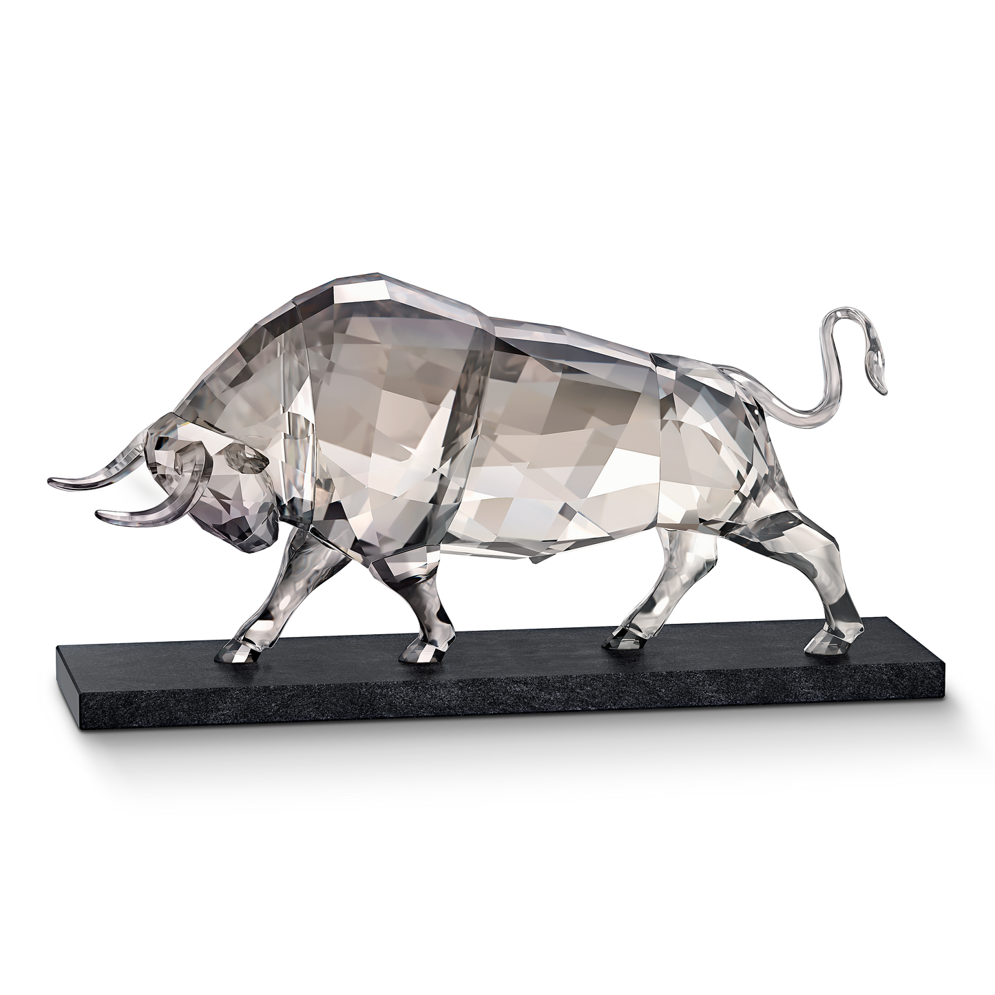 The Swarovski Soulmates Bull Crystal Home Décor piece features a transparent, geometric design with sleek, angular shapes standing on a black rectangular base. Its reflective surfaces enhance an elegant and modern aesthetic against the plain black backdrop, showcasing the exquisite craftsmanship that Swarovski is renowned for.