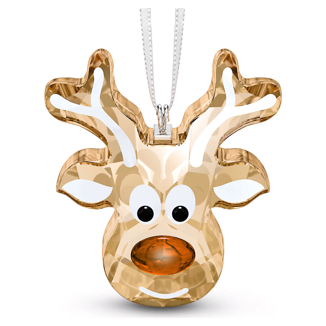 The Swarovski Gingerbread Reindeer Ornament Home Décor, crafted by Swarovski, depicts a reindeer's head adorned with antlers and large cartoon-like eyes. It boasts a shiny orange nose and hangs gracefully from a silver ribbon, bringing an elegant touch to your holiday decorations.