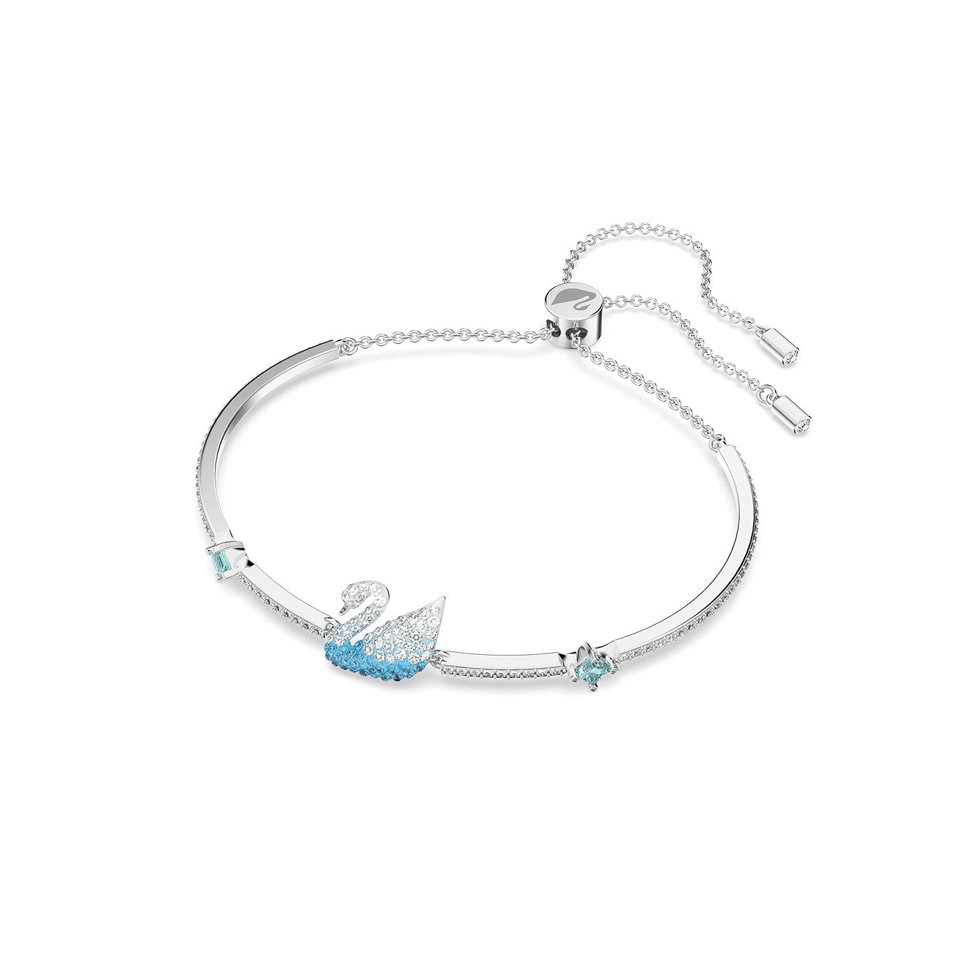 The Swarovski Iconic Swan Bangle is a stunning silver bracelet featuring a swan-shaped charm adorned with white and blue crystals. This exquisite piece includes an adjustable sliding closure, complemented by small square blue gemstones flanking the swan charm for added elegance.