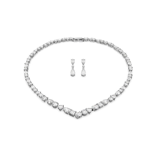 The Swarovski Mixed Cuts Tennis Deluxe V Necklace and Earring Set includes a stunning V-shaped necklace paired with matching drop earrings, all beautifully crafted in rhodium-plated white metal and showcased against a white background.