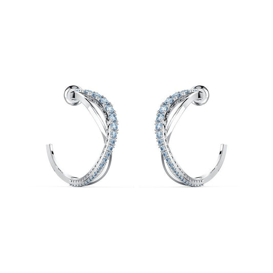 A pair of elegant Swarovski Twist Hoop Pierced Earrings are displayed against a white background. These rhodium-plated, silver curved hoops are adorned with small, light blue stones, exuding a sophisticated and luxurious allure characteristic of Swarovski jewelry.