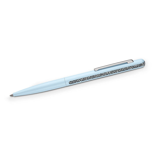 A sophisticated Swarovski Crystal Shimmer Ballpoint Pen in light blue, featuring a silver clip embellished with radiant Crystal Rocks, is set diagonally against a plain white backdrop.