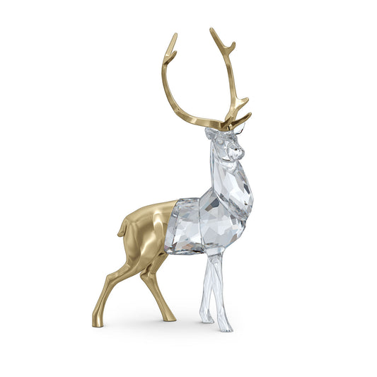 The Swarovski Holiday Magic Stag Home Décor, crafted by Swarovski, is a sophisticated sculpture featuring antlers with a distinct design of half gold and clear crystal facets. This remarkable decorative piece stands gracefully on a white background.