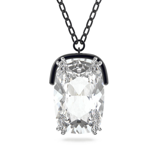 Introducing the Swarovski Harmonia Oversized Crystal Necklace Pendant: A breathtaking accessory featuring a stunning elongated cushion-cut crystal, meticulously set in a sleek black metal prong setting. Hanging gracefully from a matching black chain, this necklace captures light beautifully for an elegant evening look that is sure to impress.