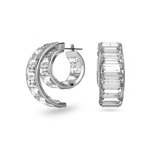 Presenting the Swarovski Baguette Cut Matrix Hoop Earrings, these stunning pieces glisten with baguette cut crystals set in a rhodium plated finish. One earring is displayed from the side and the other from the front, both against a white background to highlight their detailed and elegant design.